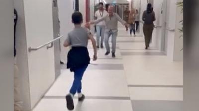 Ohad Munder run towards his father