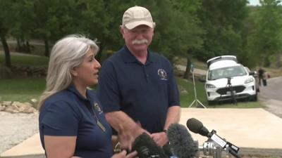 The parents of US marine Trevor Reed, talking to press microphones.