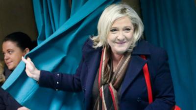 Marine Le Pen leaving a voting booth