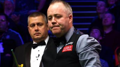 John Higgins celebrates