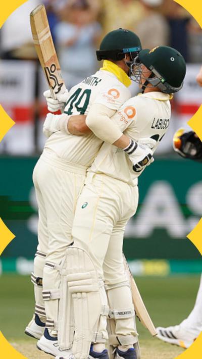 Steve Smith and Marnus Labuschagne of Australia celebrate on day two of the First 2025/26 Ashes Series Test Match 