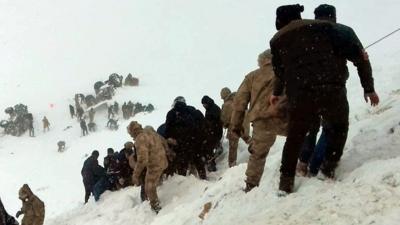 Rescuers try to reach victims of Turkey avalanches