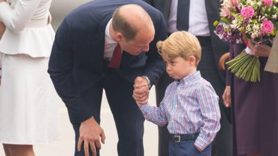 Prince William speaks to son George in Warsaw