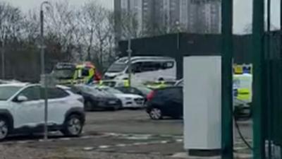 Police examine video that appears to show two officers trying to stop a member of the public filming.