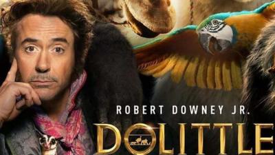 Dolittle-film-poster-showing-Robert-Downey-Jr-and-some-wild-animals.