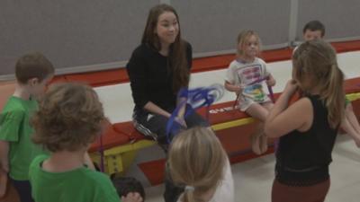 Frankie Jones with young gymnasts