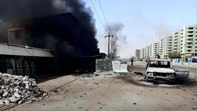 A battle-damaged street in Khartoum, Sudan