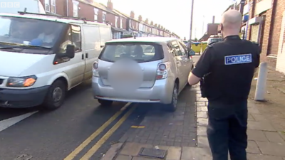 Car parked on double yellow lines