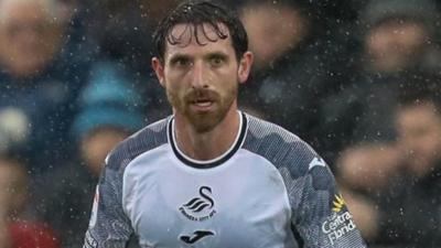 Joe Allen in action for Swansea