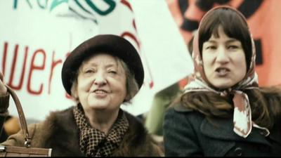 Two women on a march for women's rights in a scene from The Divine Order