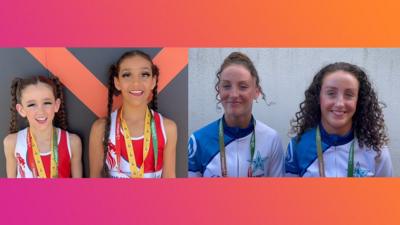 Four girls smiling at camera