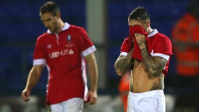 Salford City players look dejected after conceding against Hartlepool