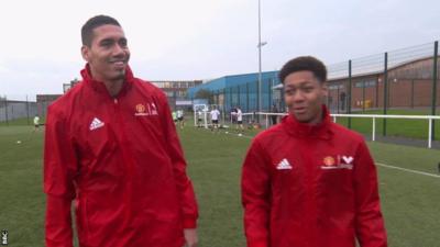 Chris Smalling and a young volunteer