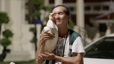 Man holding duck