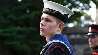 A sea cadet rehearsing