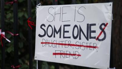 A poster reading: She is someone