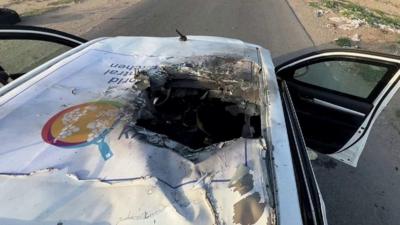 White vehicle with hole in the roof