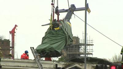 Helicopter being lifted