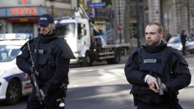 Armed French police patrol the north of Paris.