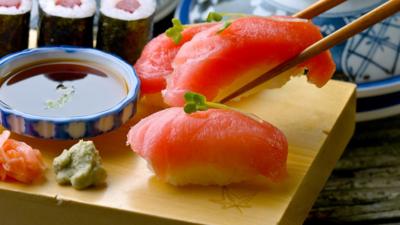 Salmon sushi on a wooden board