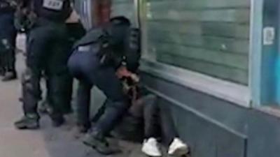 Footage shows Paris police officer punch protester