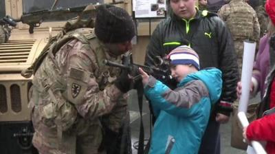 US soldier with boy in Zagan, Poland