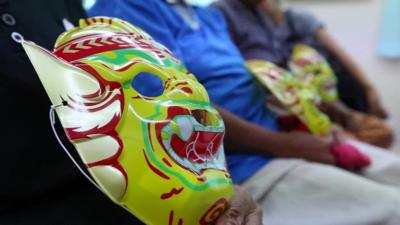 Mask for a woman in Thailand having a smear test