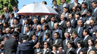 Members of Thailand's National Reform Council gather for a photo shoot before voting on the constitution