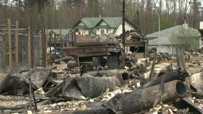 charred metal remains of a house