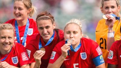 England collect their bronze medals