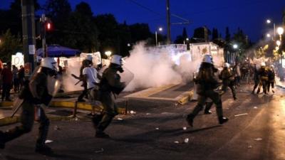 Riot police use teargas in front of the Greek Parliament on July 15, 2015 in Athens, Greece.