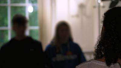 Anonymous children talking to a reporter.