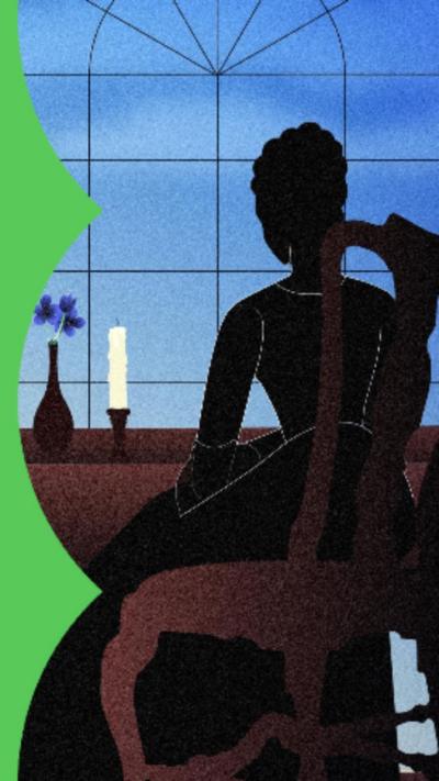 Silhouette of a woman sat at a desk with a candle and a flower in a vase