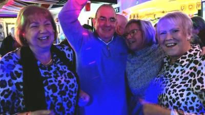 Four people enjoying the library disco in Gloucester