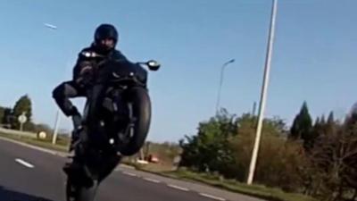 Biker doing wheelie