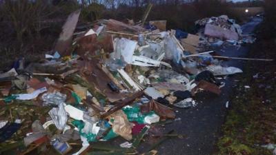 The waste on a road near Stansted in Essex will not be removed for at least four days.