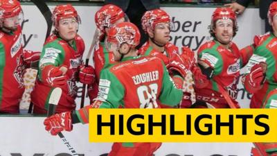 Jake Coughler celebrates scoring with the Cardiff Devils bench