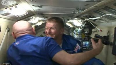 British astronaut Major Tim Peake emerging from the Soyuz space capsule hatch at the the International Space Station