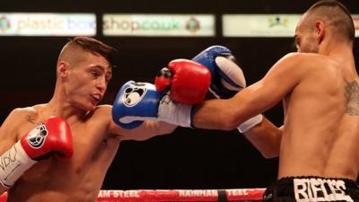 Ryan Burnett (left) throws a punch against Robert Kanalas