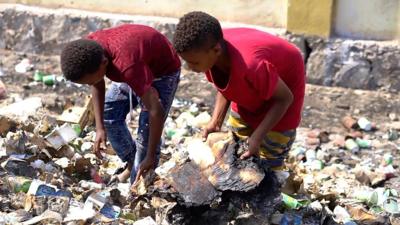 Children rummage for food