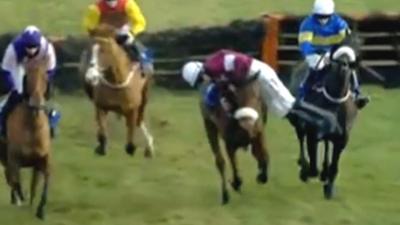 Amazing acrobatics from jockey to stay on horse