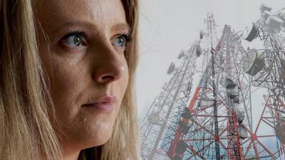 Emma looking at phone masts