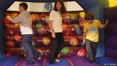 Liz Kendall on a bouncy castle