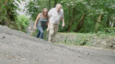 People walking up hill