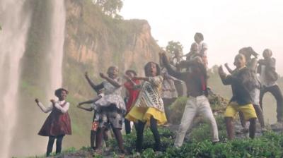 watoto children's choir sing by the waterfall