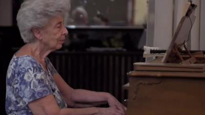 May Melki at her piano in Beirut