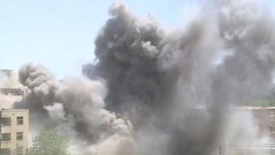 Smoke above buildings in Khartoum