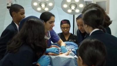 Schoolchildren learning about stab wounds