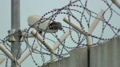 Barbed-wire wall surrounds a registration centre in Zagreb