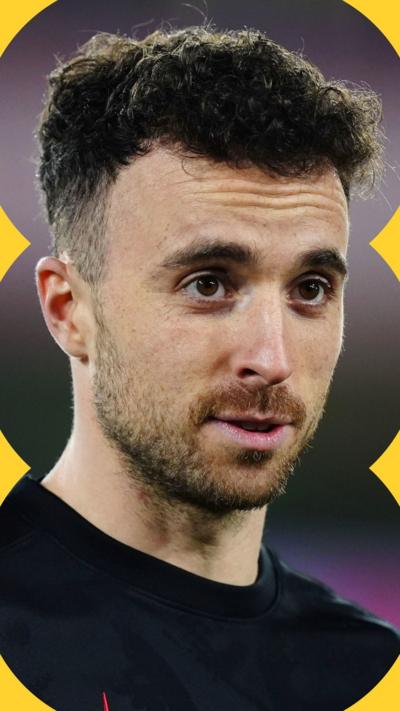 Diogo Jota in January 2025 - he has short curly dark hair and wears a black top